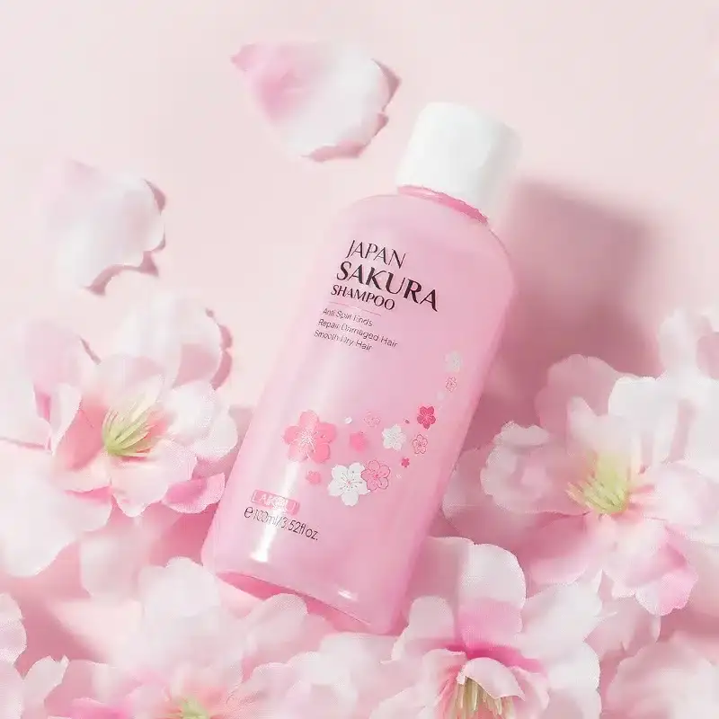 Two Laikou Japan Sakura 400ml and smaller pink bottles with white pump tops. - thumbnail