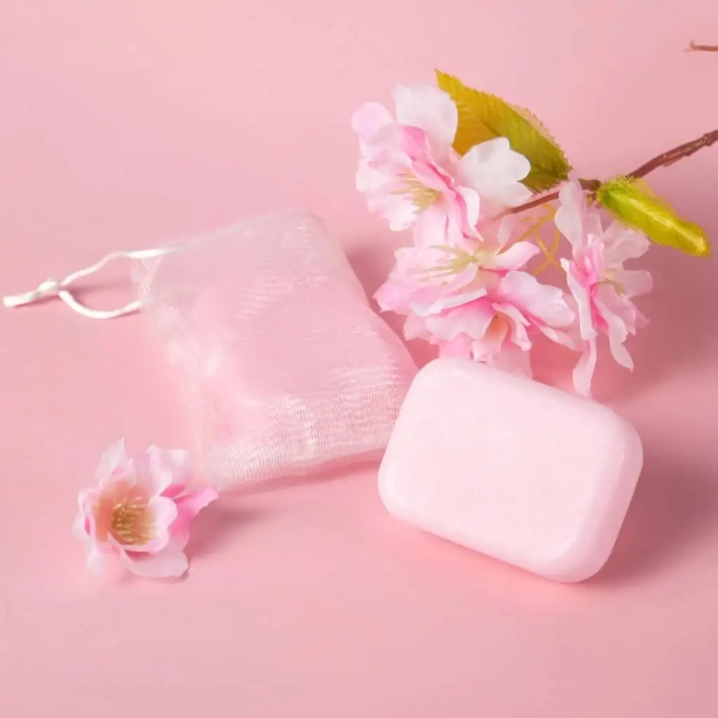 Multiple Laikou Japan Sakura pink handmade soap bars, neatly stacked on display. - thumbnail