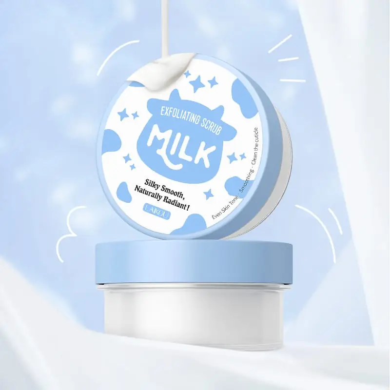Hand squeezing Laikou Milk Exfoliating Scrub, revealing white creamy texture with fine beads. - thumbnail