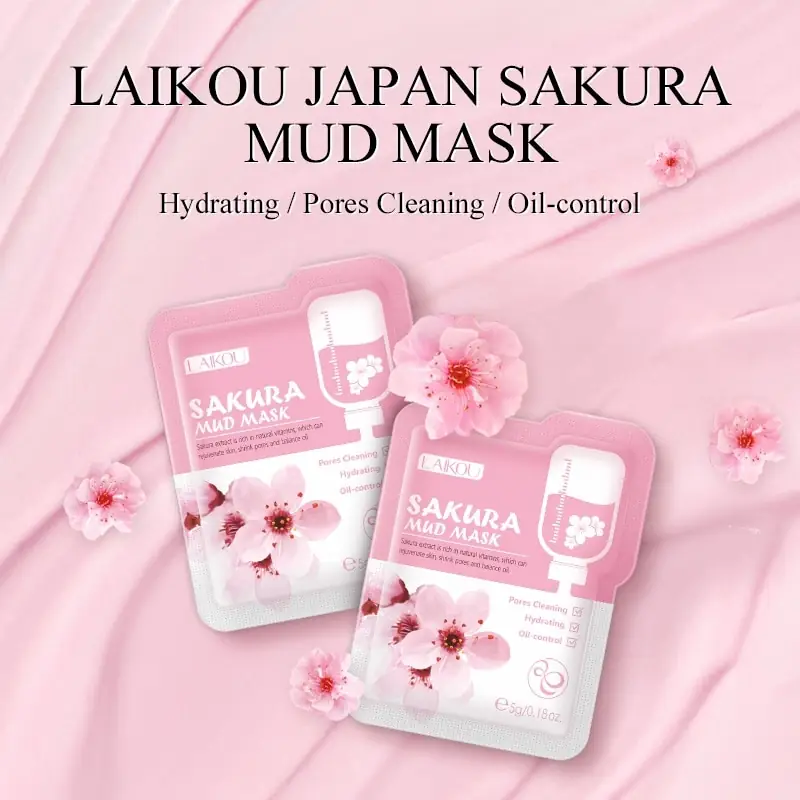 Pink Laikou Sakura Mud Mask gently squeezed from a sachet onto fingertips, displaying its creamy texture. - thumbnail