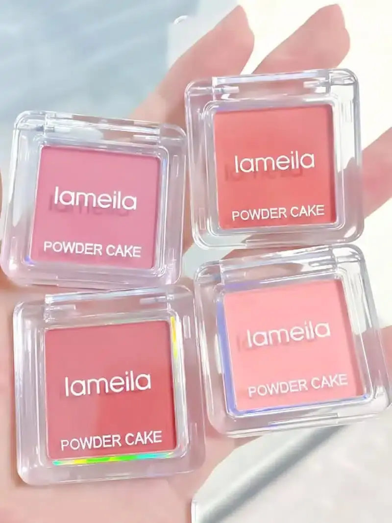 Close-up of Lameila Candy Blush 04 open compact with peach-pink powder and applicator brush. - thumbnail