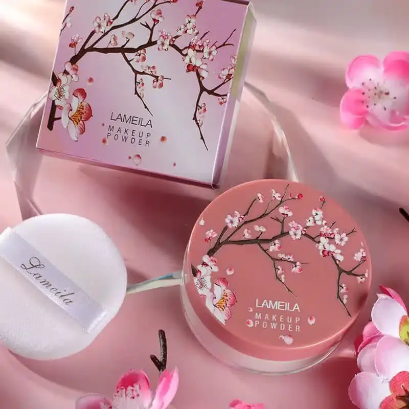 Close-up of Lameila Loose Powder 03, showcasing its luxurious gold lid and soft applicator. - thumbnail