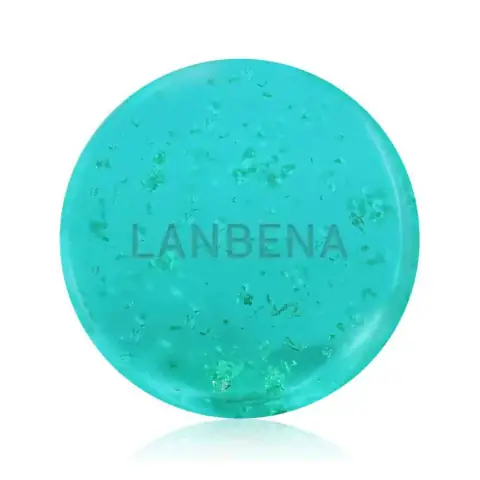 Two Lanbena 24K Gold moisturizing handmade soap bars, translucent amber with visible gold flakes.