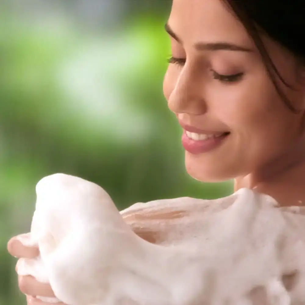 Two Lux French Rose & Almond Oil body wash bottles, pink, shown from different angles. - thumbnail