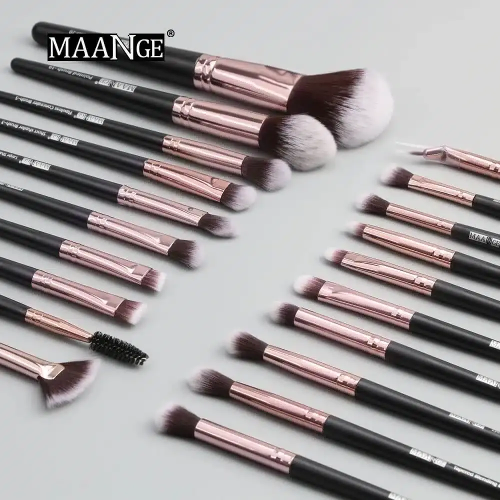 Close-up of a Maange black makeup brush held in hand, showcasing its soft, dense bristles. - thumbnail