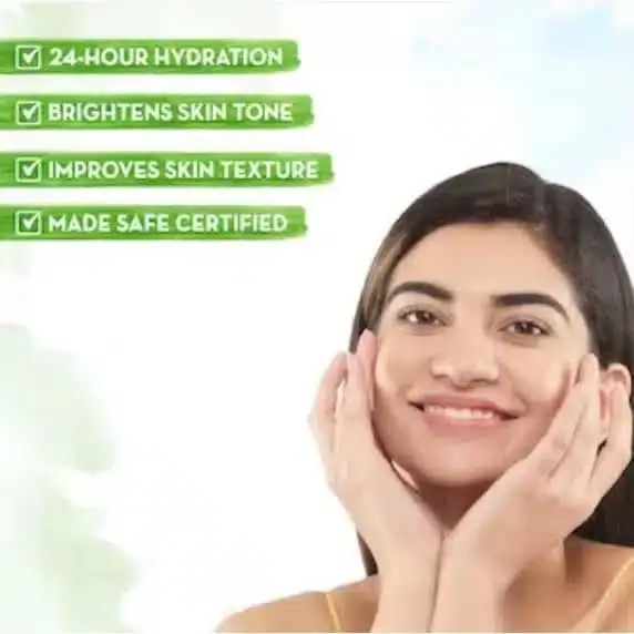 Hand applying a small dollop of Mamaearth Rice Oil Free Face Moisturizer onto fair skin. - thumbnail