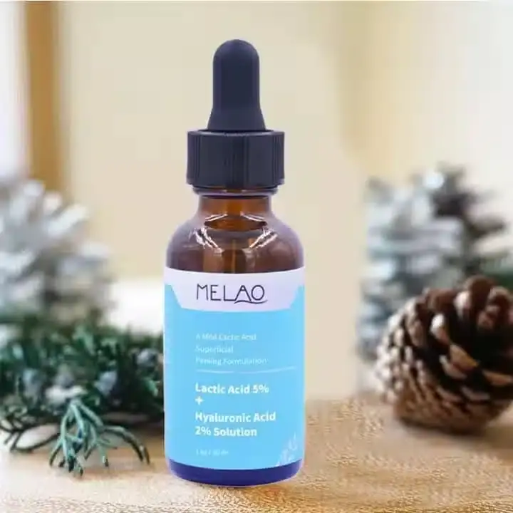 Melao Lactic Acid serum 30ml transparent bottle and pink box, both lying sideways. - thumbnail