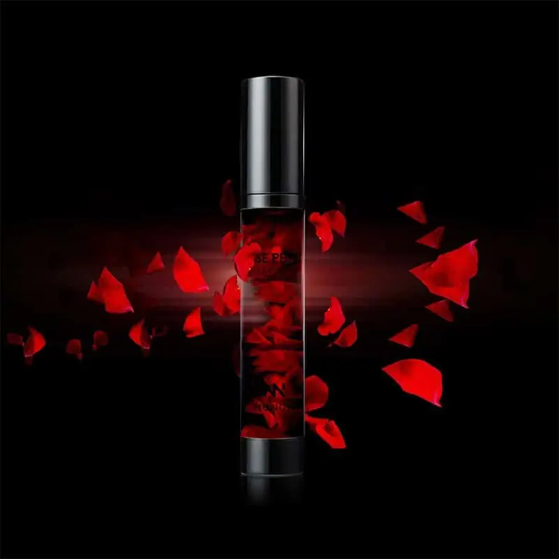 Close-up of Menow Rose Petal Essence bottle, showing real petals and gold dropper cap. - thumbnail