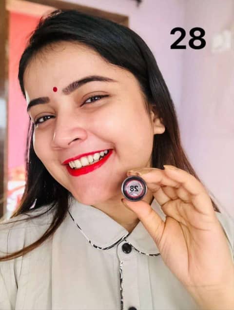 Sleek black tube of Menow Velvet Lipstick Waterproof Lipgloss #28, showing its rich dark red shade.