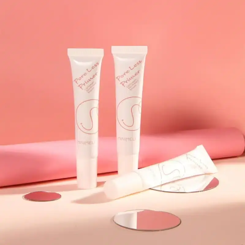 Minimeli Pore Invisible Primer bottle with a small translucent white product swatch showing texture. - thumbnail