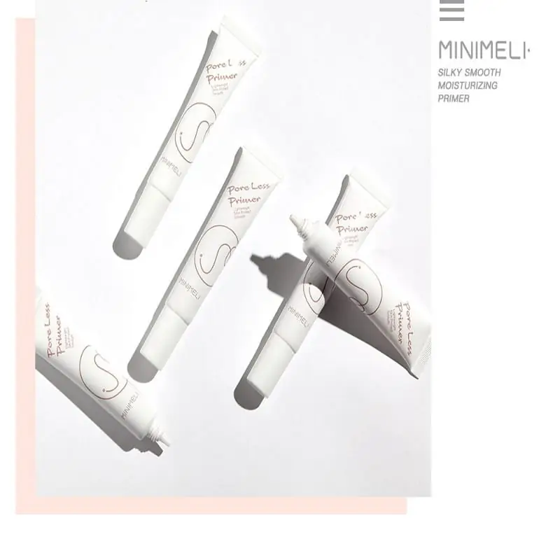 Minimeli Pore Invisible Primer 12ml bottle held gently in a hand, ready for application. - thumbnail