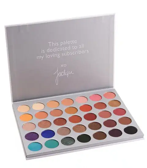 Open Morphe Jaclyn Hill eyeshadow palette, displaying 35 vibrant makeup shades in matte and shimmer.