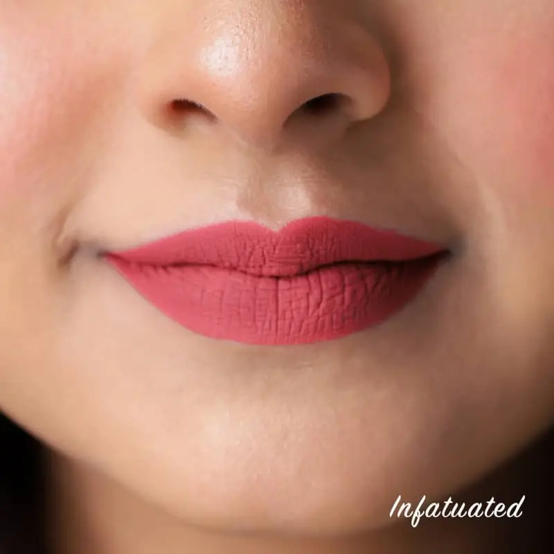 Model wearing Nirvana Color Liquid Matte Lipstick 'Infatuated' for a stunning, smooth matte finish. - thumbnail