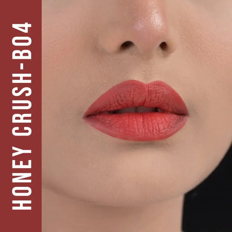 Nirvana Honey Crush B04 matte lipstick swatch on skin, displaying the true color and texture. - thumbnail