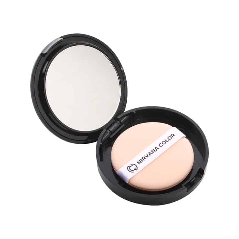 Nirvana Color light golden compact powder open from top view, revealing mirror and applicator. - thumbnail