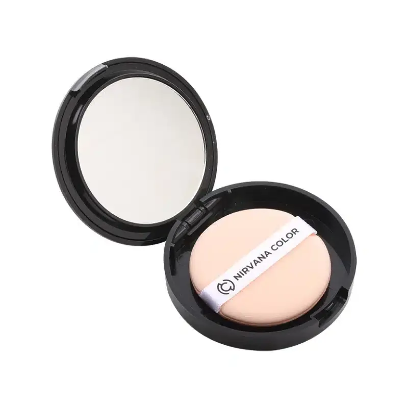Open Nirvana compact powder showing the Light Natural pressed powder pan and a mirror inside. - thumbnail