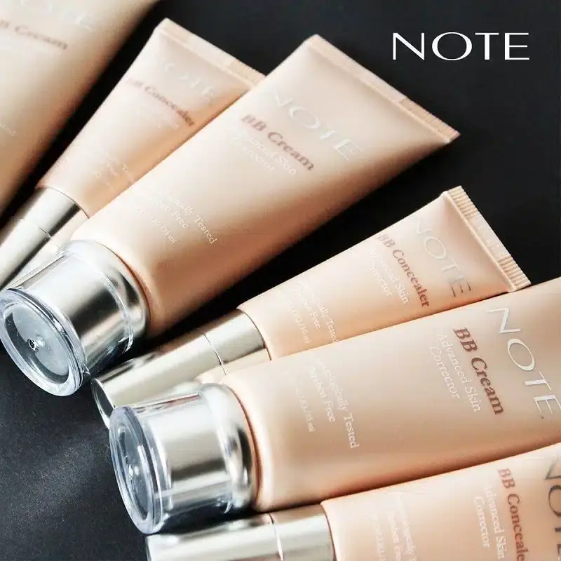 Note BB Cream tube lying horizontally next to a creamy swatch, showing light beige texture. - thumbnail