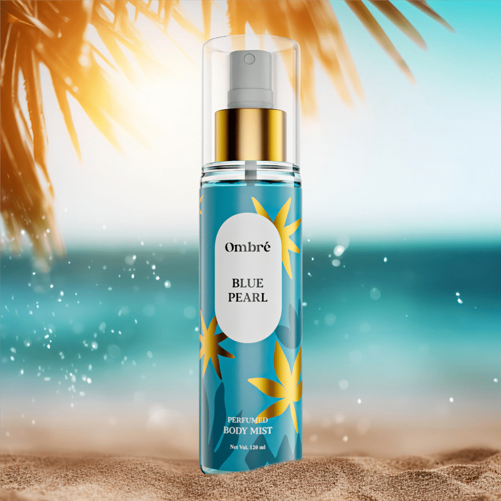 Hand holding Ombre Blue Pearl Perfumed Body Mist bottle, spraying a fine, refreshing mist. - thumbnail
