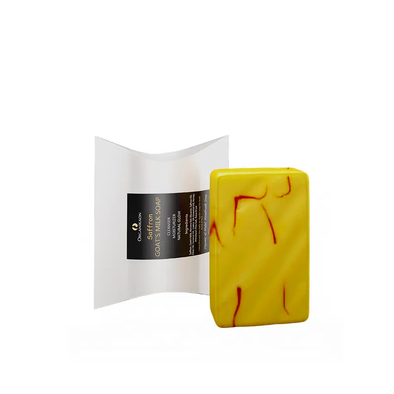 Three Organikaon Saffron Goat Milk Soap bars; two unwrapped, revealing their saffron-infused texture. - thumbnail