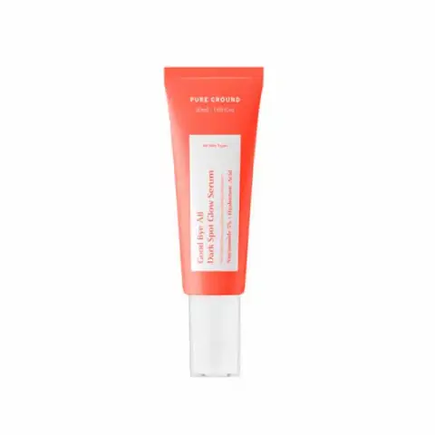 Pure Ground 50ml Dark Spot Glow Serum in clear glass dropper bottle with golden liquid.