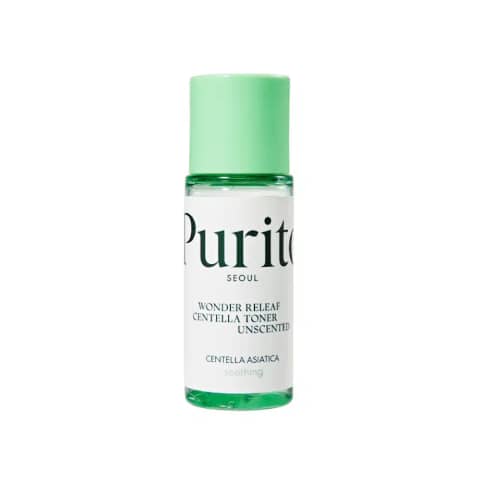 Purito Wonder Releaf Centella Toner 30ml clear bottle, green label, with fresh Centella leaves on white.