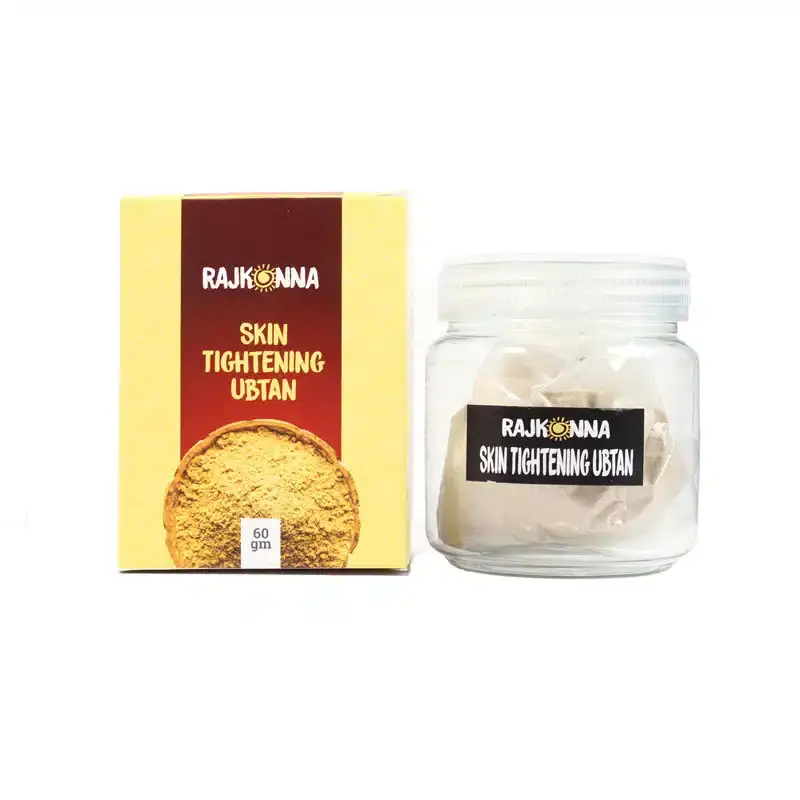 Rajkonna Skin Tightening Ubtan Powder sachet torn open, revealing fine brownish powder inside. - thumbnail