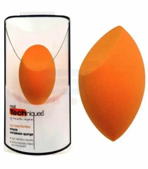 Vibrant pink RuSu Real Tech Niques beauty blenders, soft teardrop shape, angled for seamless makeup application.