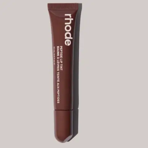 Rhode Peptide Lip Tint in rich Espresso color, a glossy clear tube with a sleek silver cap.