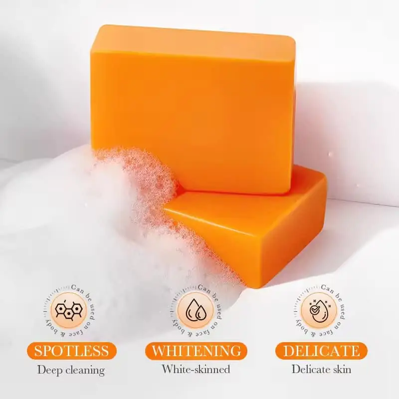 Sadoer Kojic Acid Whitening Soap: one wrapped in plastic, another unwrapped orange bar, side-by-side. - thumbnail