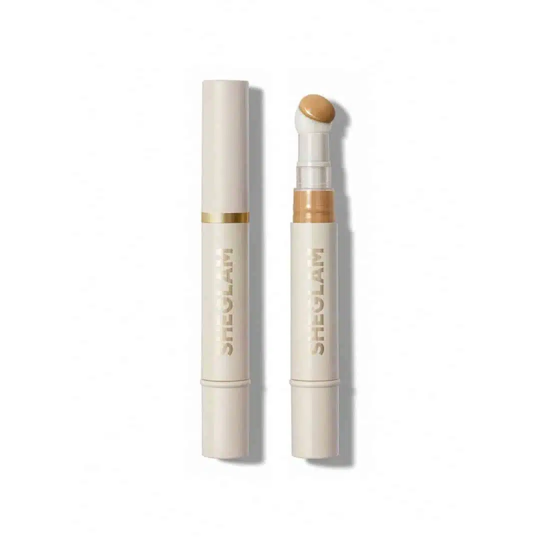 Sheglam Skin-fluencer Concealer in Sand shade, elegant tube with gold cap on white background. - thumbnail