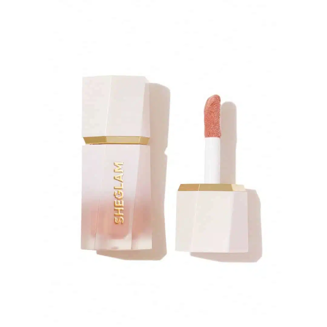 Sheglam Liquid Highlighter in Bellini Brunch shade, sleek tube packaging with silver cap. - thumbnail