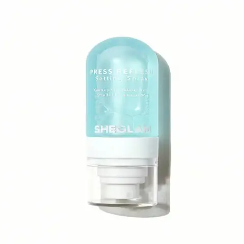 Sheglam Press Refresh Setting Spray 55ml bottle, metallic silver packaging, standing upright on white background.