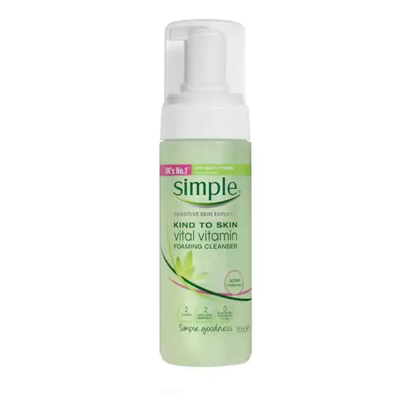 Angled view of Simple Foaming Facial Cleanser bottle, showing its gentle white foam texture. - thumbnail