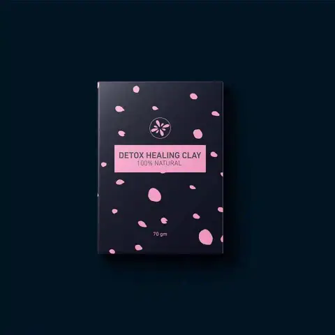 Skin Cafe Detox Healing Clay Mask in a mint green jar with white cap, angled shot.