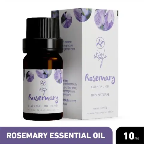 Skin Cafe Rosemary Essential Oil 10ml in amber dropper bottle with white label on a blurred green background.