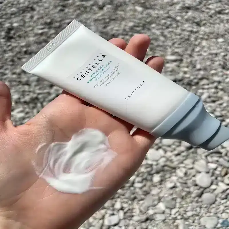 Skin1004 Centella Hyalu-Cica Sun Serum's translucent lightweight texture swatched on a clear surface. - thumbnail