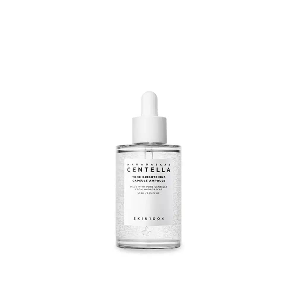 Skin1004 Madagascar Centella Tone Brightening Ampoule 50ml glass bottle with dropper, showing suspended white capsules. - thumbnail