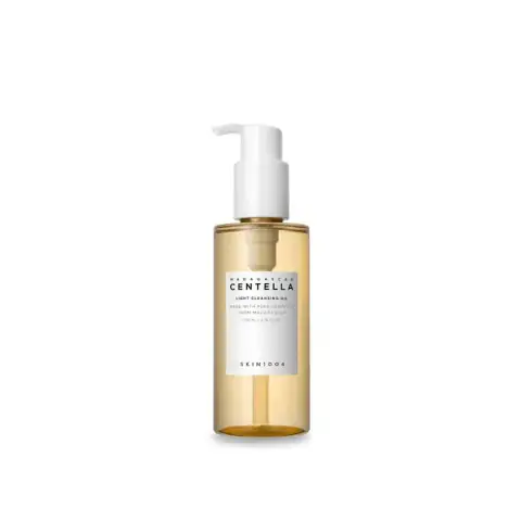 SKIN1004 Madagascar Centella Light Cleansing Oil bottle, clear with golden liquid, white pump dispenser.