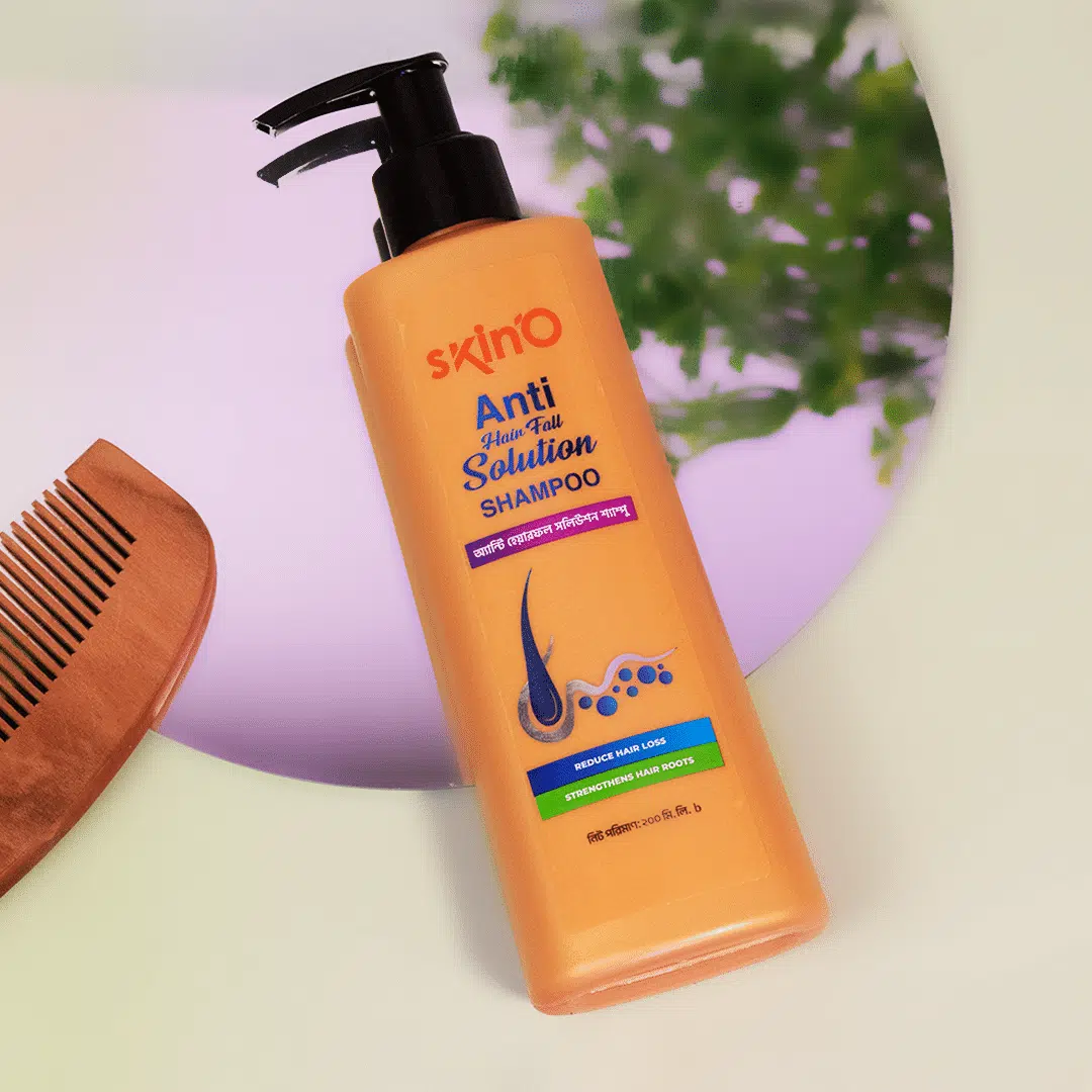 Angled view of SkinO Anti Hair Fall Solution Shampoo 200ml white bottle, highlighting black pump dispenser. - thumbnail