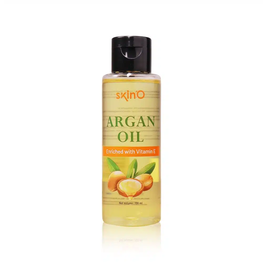 Full SkinO Argan Oil 100ml bottle, amber glass with golden pump, front-facing on light background. - thumbnail