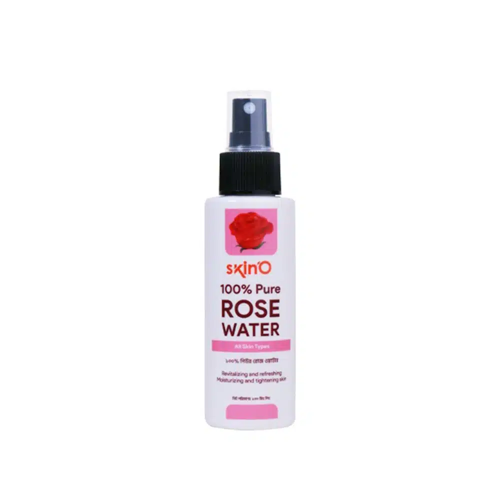 SkinO Pure Rose Water 100ml clear bottle, full, with a fresh pink rose beside it. - thumbnail