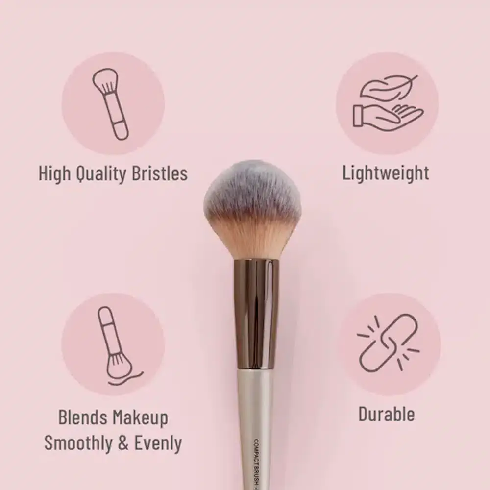 Close-up of Swiss Beauty powder brush bristles held, highlighting their soft, dense texture for application. - thumbnail