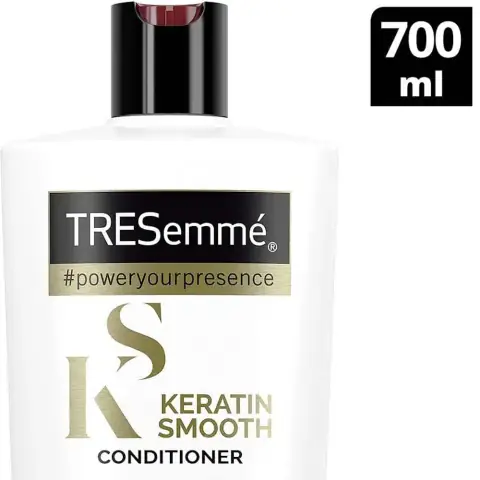Front view of Tresemme Keratin Smooth Marula Oil Conditioner 700ml, black bottle with gold pump.