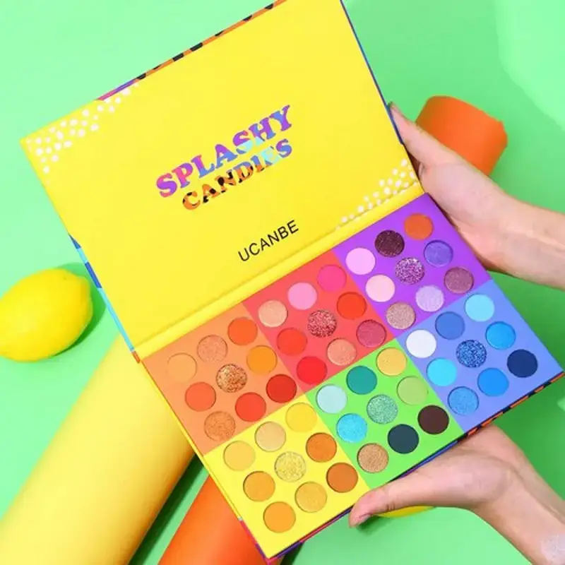 Hand swatching vibrant UCANBE SPLASHY CANDIES eyeshadows on arm, displaying rich color payoff. - thumbnail