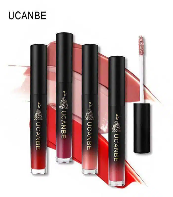 Three UCANBE Velvet liquid matte lipsticks in different shades, standing upright on a white background. - thumbnail