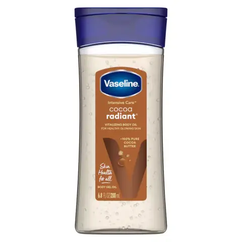 Vaseline Cocoa Radiant Body Oil 200ML in clear bottle, golden oil with white pump.