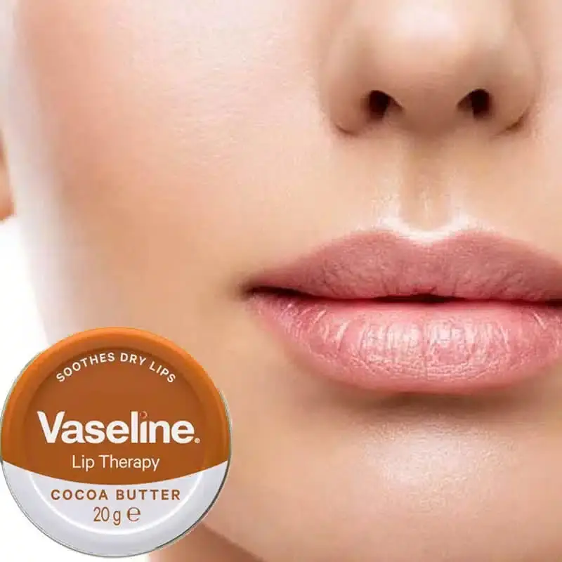 Opened Vaseline Lip Therapy Cocoa Butter 20gm tub, revealing smooth, glossy balm inside. - thumbnail