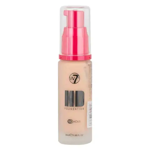 Clear glass W7 HD Foundation bottle with black pump and beige liquid content, upright.