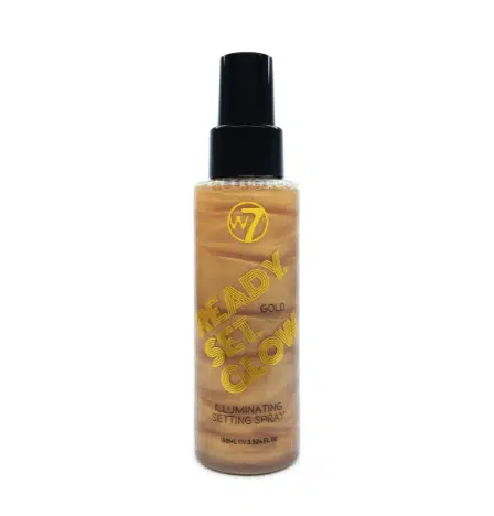 W7 Illuminating Ready Set Glow gold setting spray 100ml bottle with shimmery liquid.