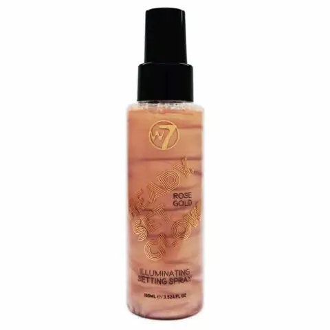 W7 Illuminating Ready Set Glow Setting Spray, 100ml, features rose gold cap and shimmering label design.